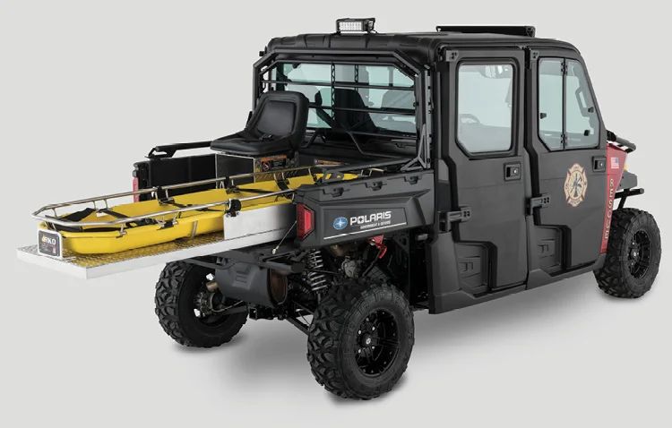 Example of a crew-cab side-by-side rescue vehicle with a yellow litter slid out on the rear cargo deck